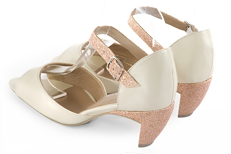 Off white and powder pink women's closed back sandals, with an instep strap. Round toe. Medium comma heels. Rear view - Florence KOOIJMAN